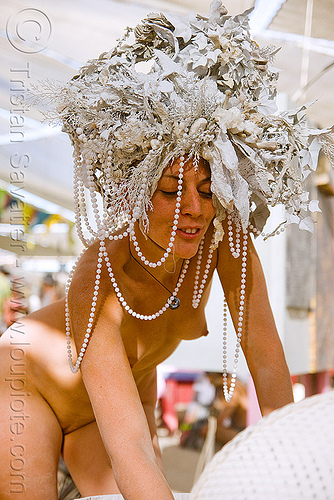 goddess with white hat and beads - burning man 2009