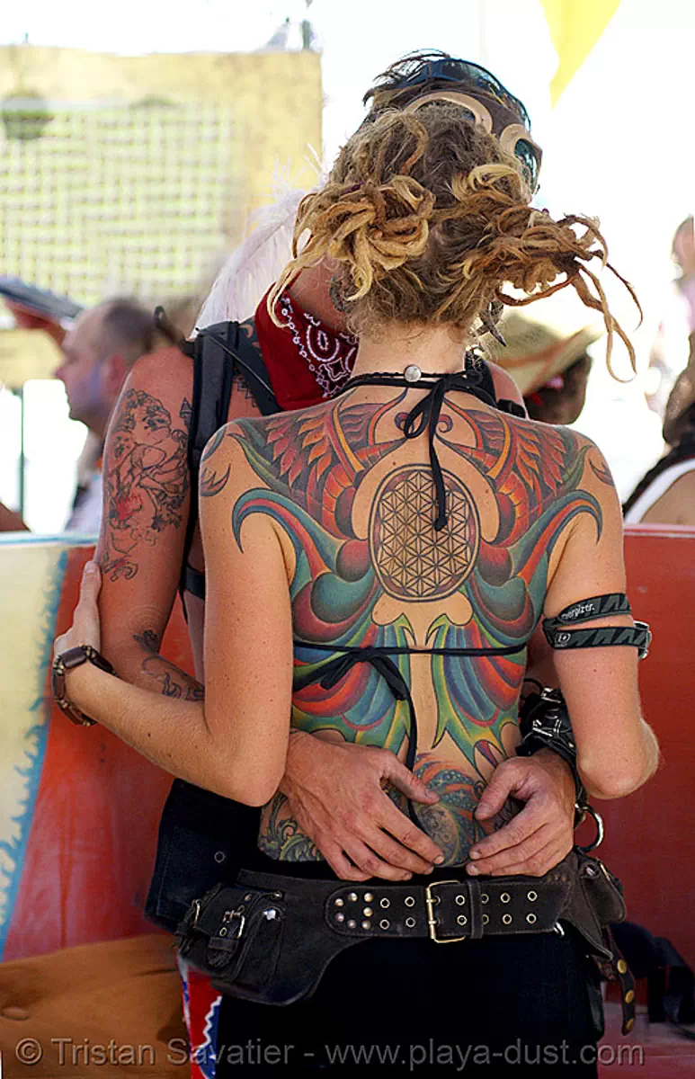 amanda's beautiful tattooed back - burning man 2007, backpiece, burning man festival, center camp, tattoo, stock photo