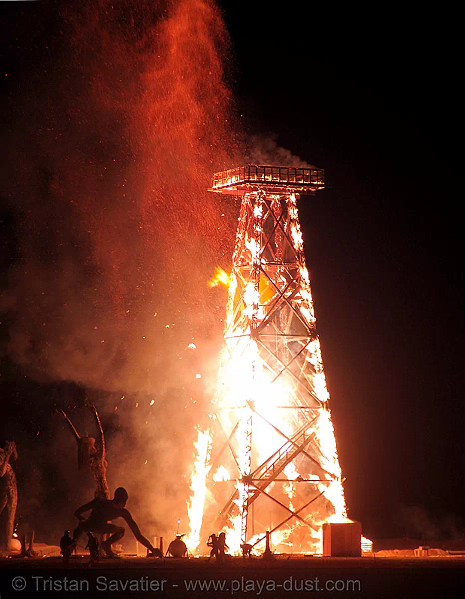 crude awakening - burning man 2007, burning man festival, dan das mann, fire, night, oil derrick, wood tower, stock photo
