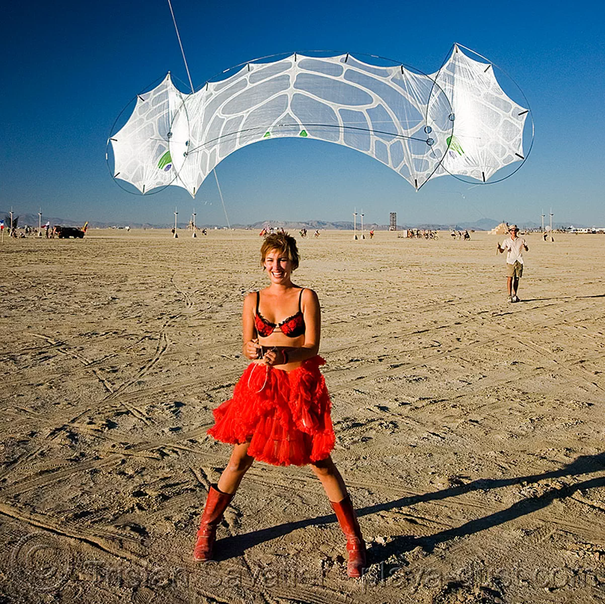 kite - rachel - department of tethered aviation (DOTA) - burning man 2008, articulated kite, burning man festival, modern kite, playa, red dress, windfire design
