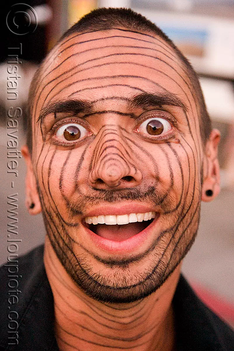 face paint - makeup - crazy-looking guy - burning man decompression 2008 (san francisco), circles, face painting, facepaint, stock photo