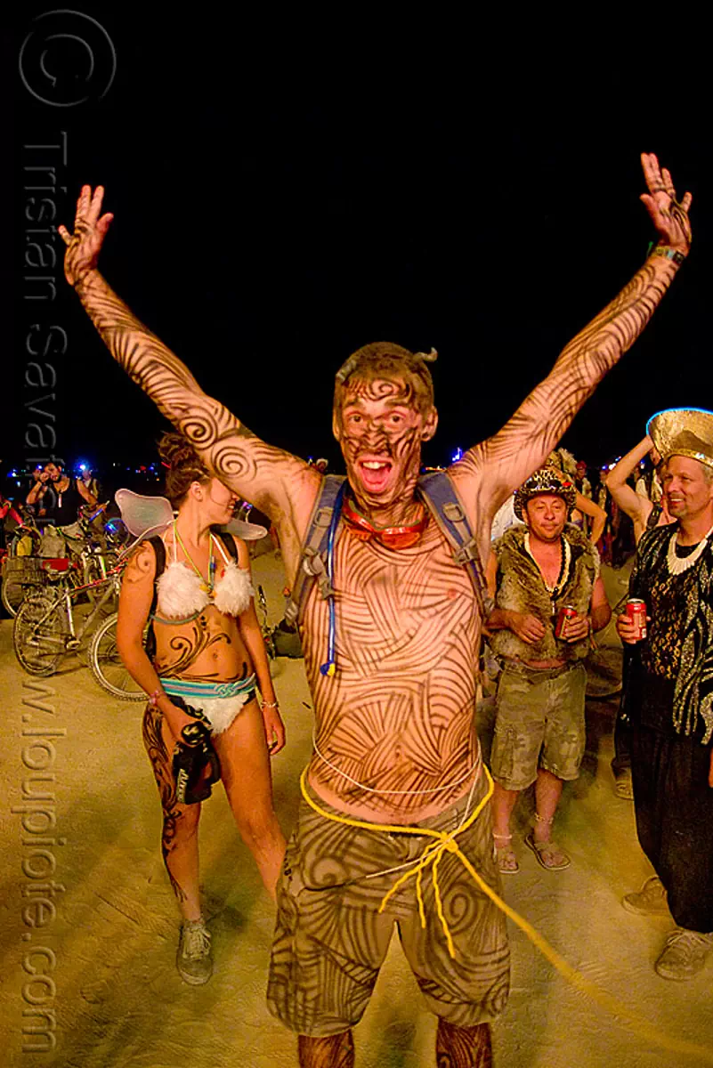 ian - burning man 2009 - body-paint, body paint, body painting, burning man festival, night, yellow rope, stock photo
