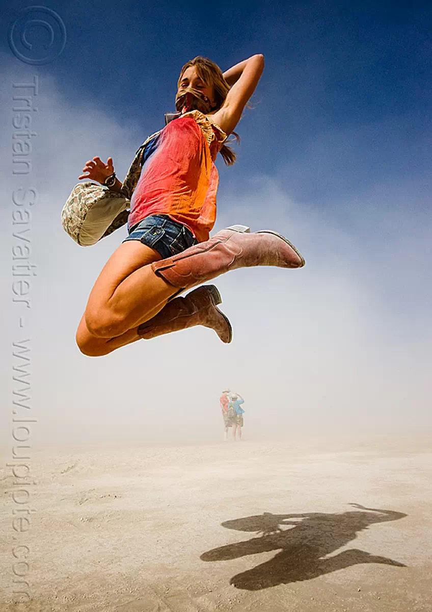 rachel jumping - burning man 2009, burning man festival, cowboy boots, jump shot, jumper, people flying, santiags, shadow, tiags