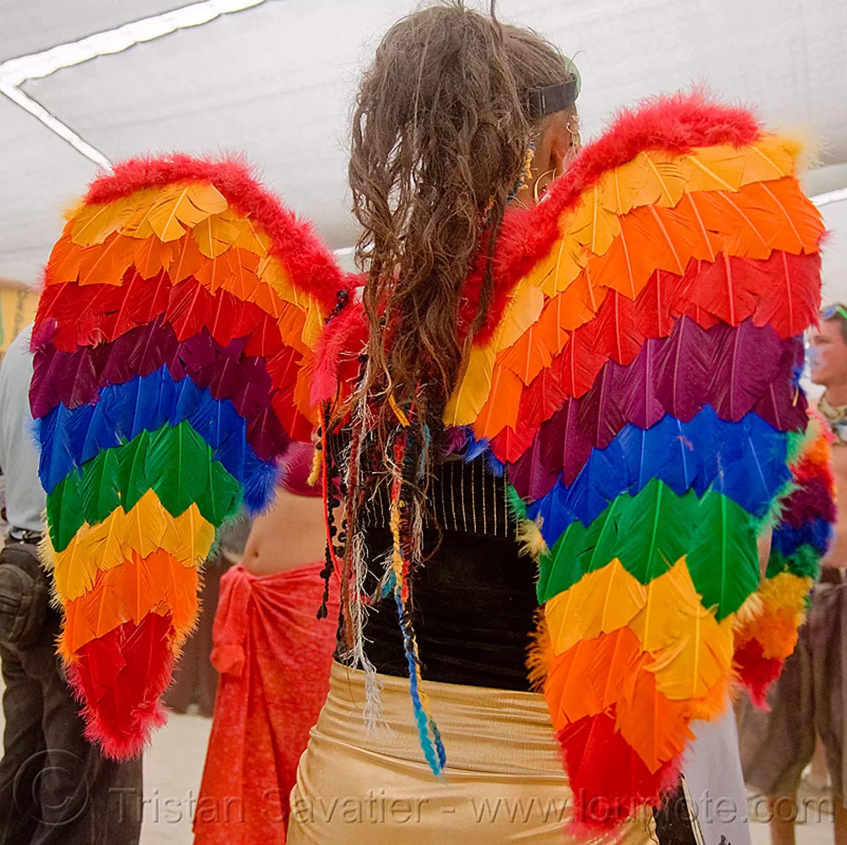 hannah the rainbow angel - burning man 2009, angel wings, burning man festival, feathers, rainbow colors, stock photo