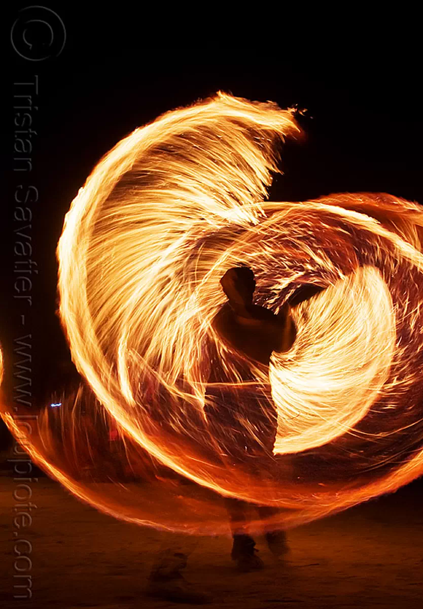 spinning fire ropes - burning man 2009, burning man festival, fire dancing, fire performer, fire spinning, flame, long exposure, night, rire rope