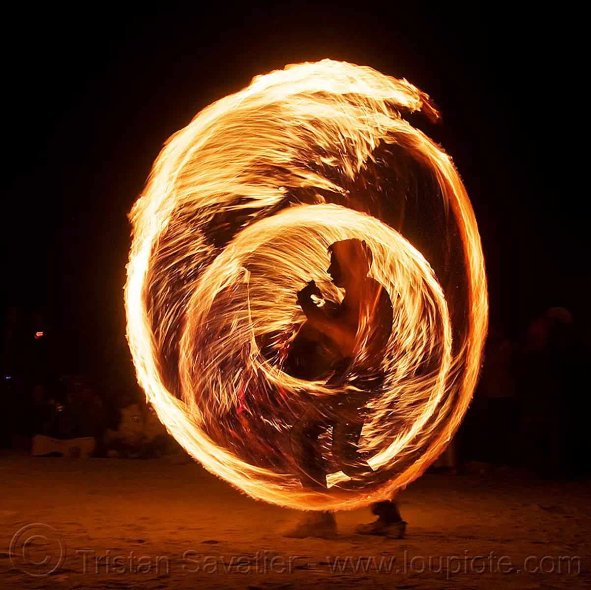 fire ropes - burning man 2009, burning man festival, fire dancing, fire performer, fire spinning, flame, long exposure, night, rire rope, silhouette, spinning fire, stock photo