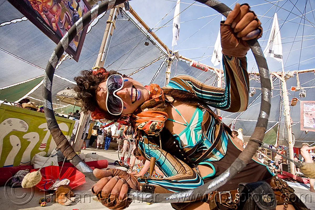 ahni radvany hooping at center camp - burning man 2010, ahni radvanyi, burning man festival, hula hoop, hula hooper, hula hooping, mini hoop, stock photo
