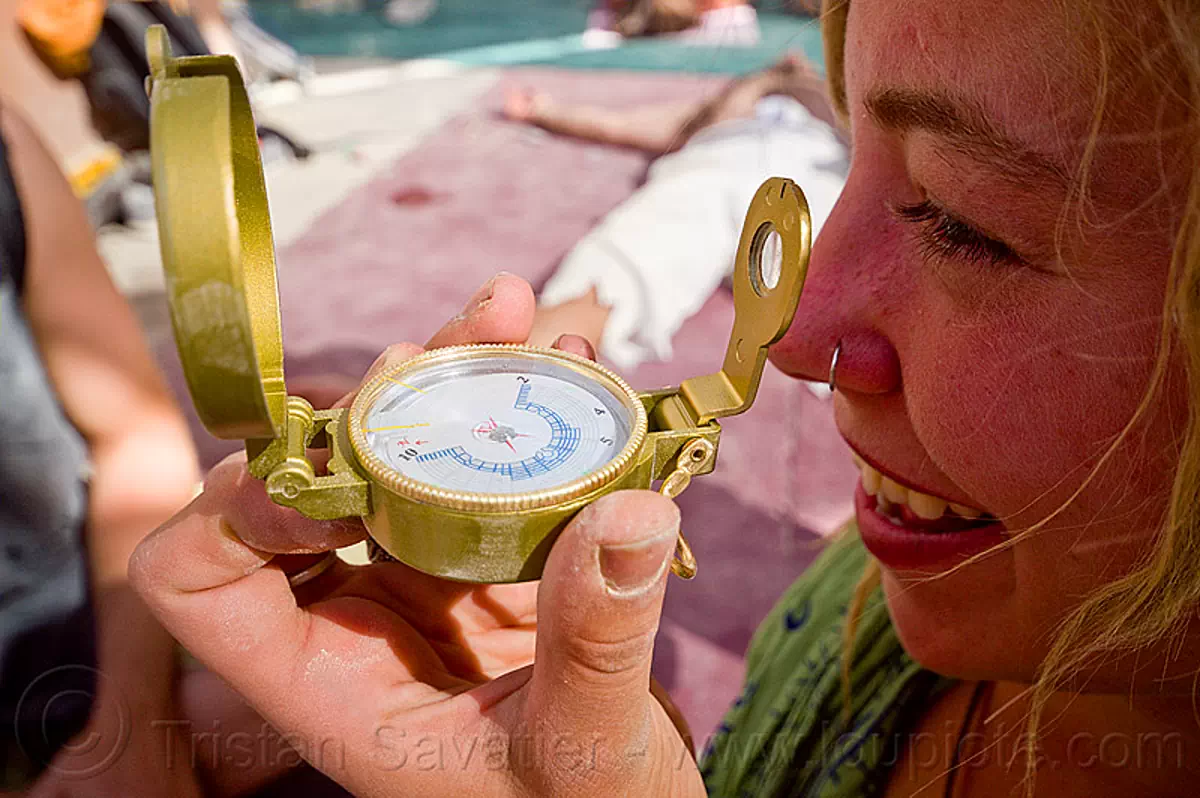 black rock city compass - burning man 2012, burning man festival, hand, holding, stock photo
