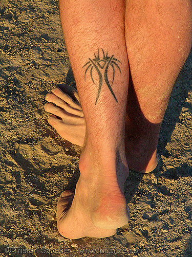  This tattoo is a reference to the burning man festival (Nevada).