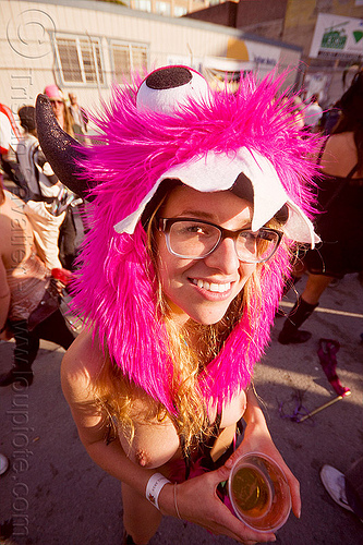 how weird 2012, fuzzy headdress, muppet monster, pink headdress, prescription glasses, teeth, topless, woman