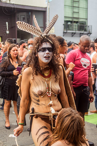 woman in tribal fetish costume, blow job, body paint, body painting, costume, dildo harness, feathers, fetish, makeup, man, necklace, rope bondage, sex toy, strap on, topless, tribal, woman