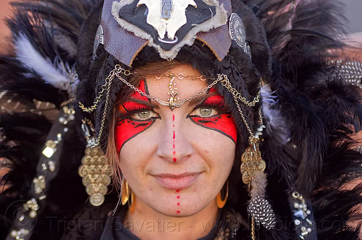 tribal headdress, chain jewelry, red face paint