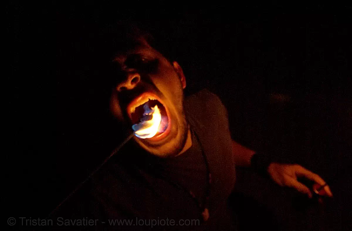 eric eating fire (san francisco), fire dancer, fire dancing, fire eater, fire eating, fire performer, fire spinning, flame, mouth, night, spinning fire, stock photo