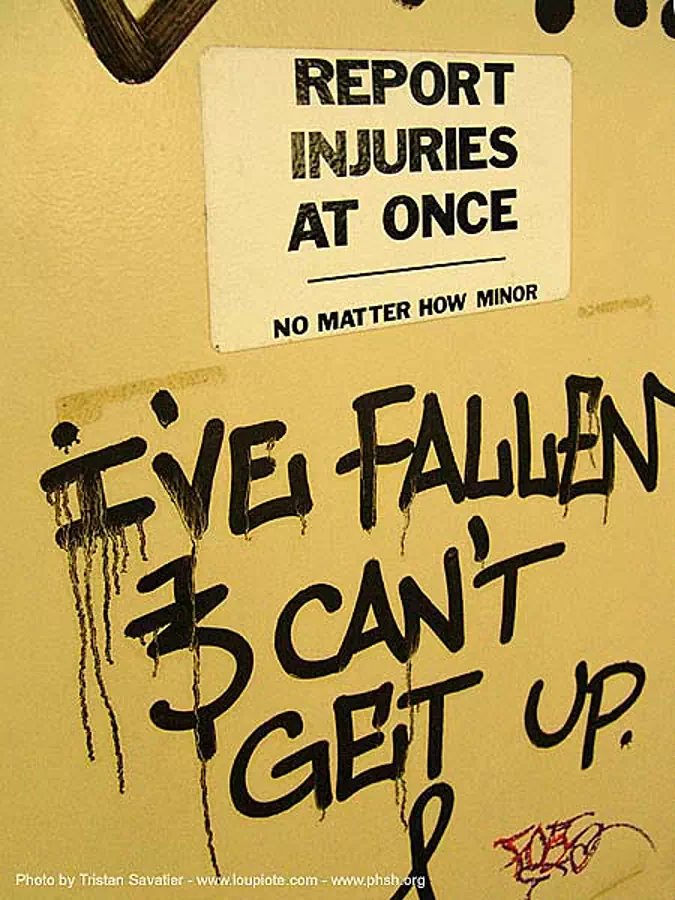 report-injuries-at-once - sign - graffity - abandoned hospital (presidio, san francisco) - phsh, abandoned building, decay, graffiti, presidio hospital, presidio landmark apartments, trespassing, urban exploration, stock photo