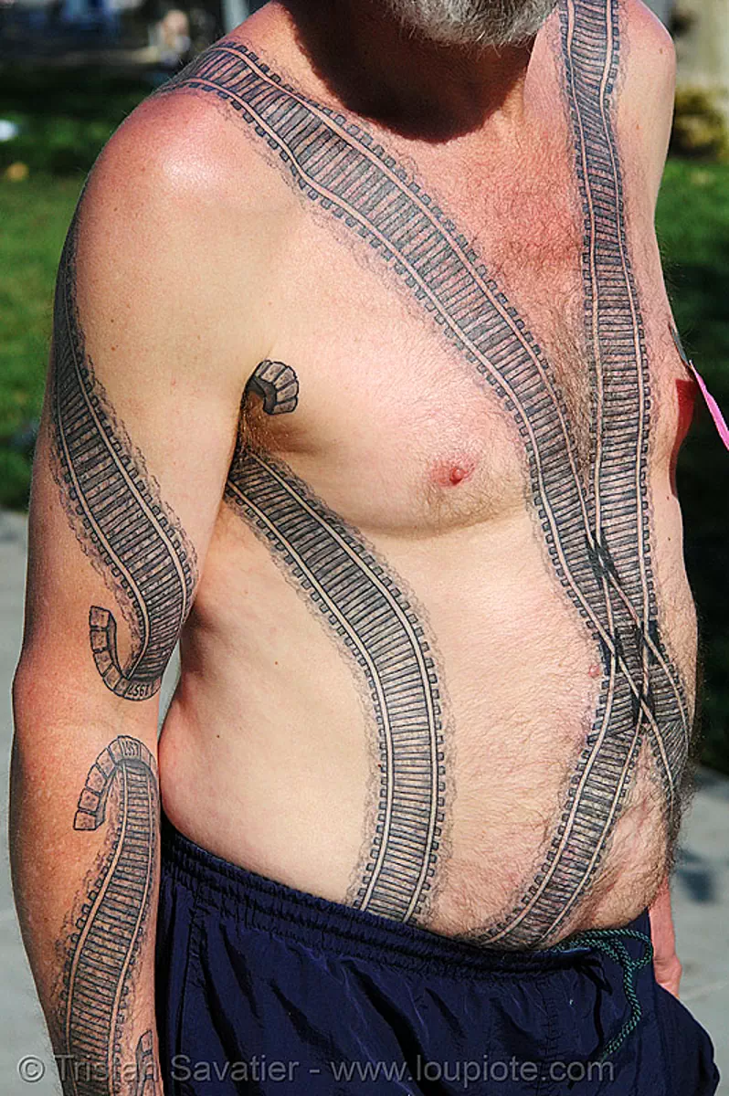 railroad tattoo - chest and arm, chest tattoo, darryl, freight hopping, full body tattoos, rail tracks, railroad switch, railroad tracks, rails, railway frog, skin, tattooed, torso, train tracks, train tunnel, stock photo