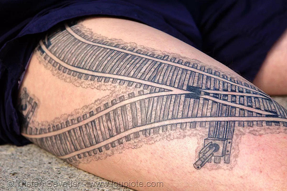 railroad tattoo - rails switch - thigh, darryl, freight hopping, full body tattoos, leg, rail tracks, railroad switch, railroad tracks, railway, skin, tattooed, train tracks, train tunnel, stock photo