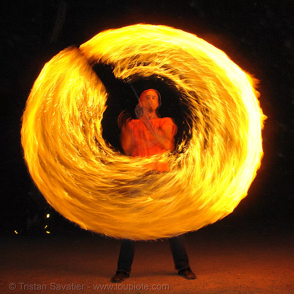 shanti (alex) spinning a fire staff (san francisco), circle, fire dancer, fire dancing, fire performer, fire spinning, flame, long exposure, night, ring, spinning fire, stock photo