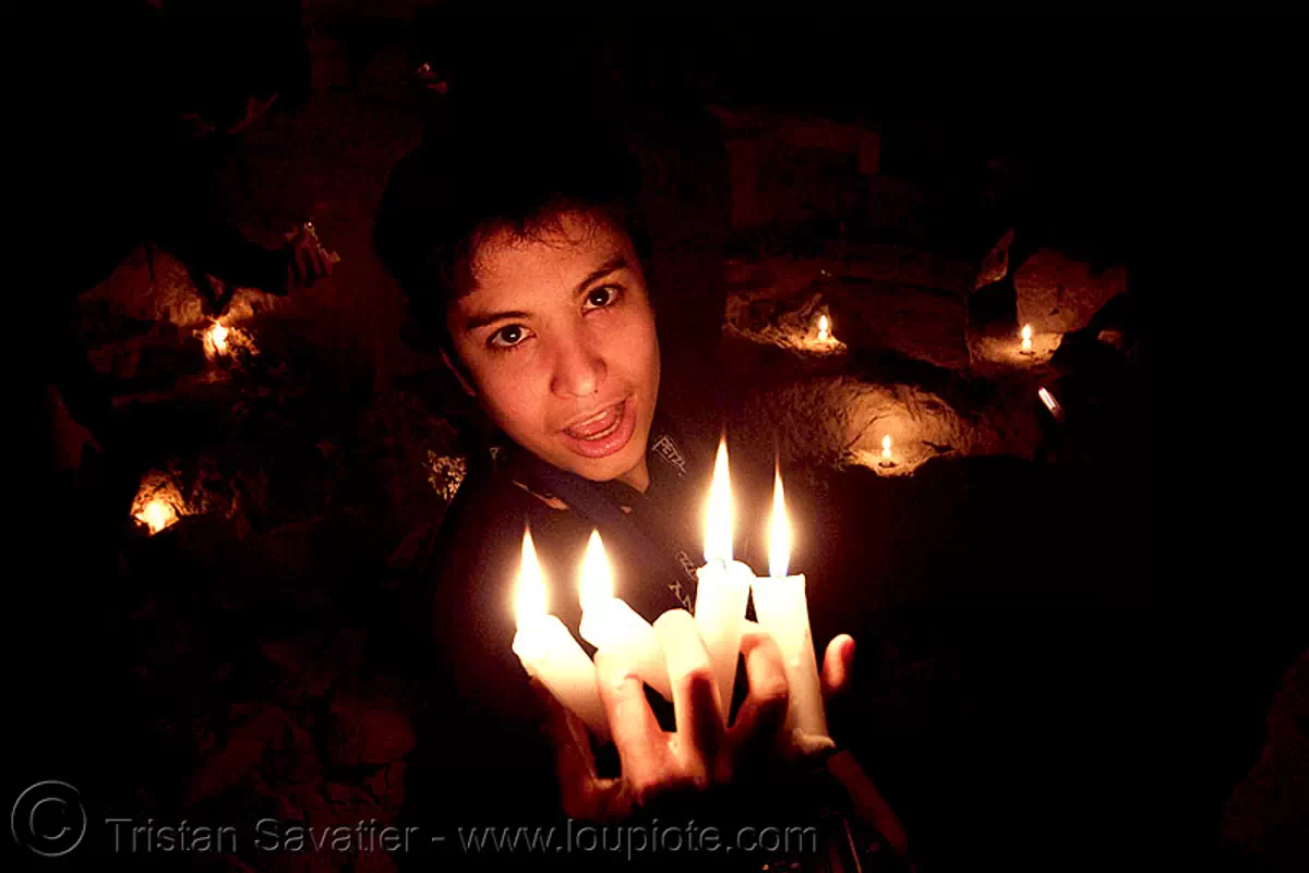 alyssa is the devil - catacombes de paris - catacombs of paris (off-limit area), androgynous, candles, cataphile, cave, fire, flames, low key, new year's eve 2008, underground quarry, wax, stock photo