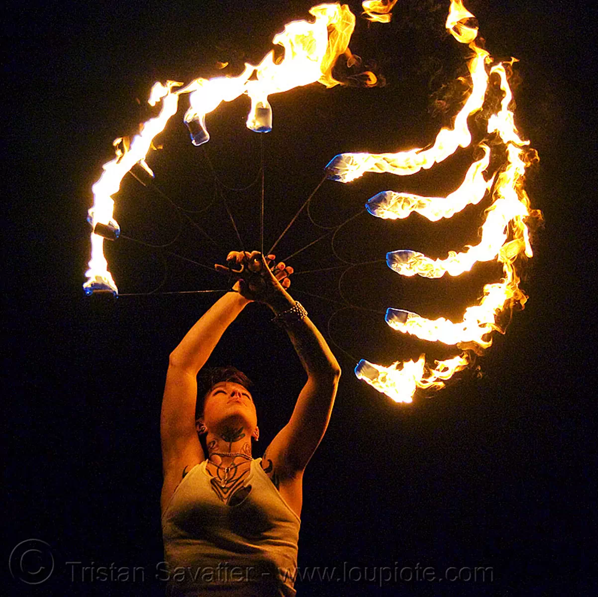 fire fans (san francisco) - fire dancer - leah, fire dancing, fire performer, fire spinning, flame, night, spinning fire, tattooed, tattoos, stock photo