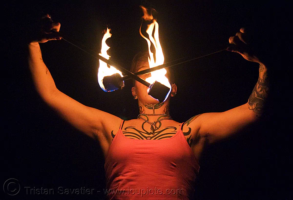 spinning fire poi (san francisco) - fire dancer - leah, fire dancing, fire performer, fire spinning, flame, night, tattooed, tattoos, stock photo