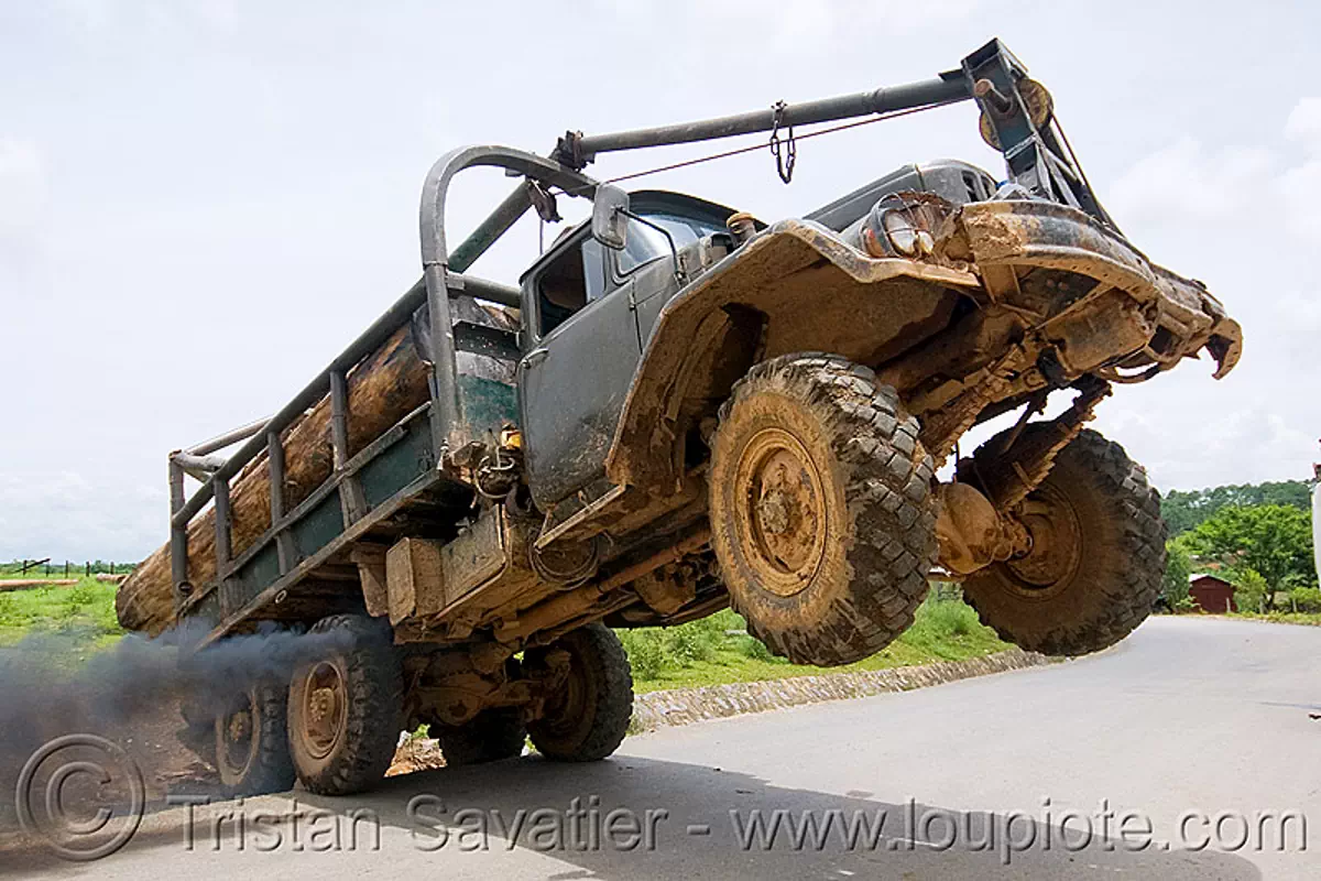 ZIL-131 - ЗиЛ-131 - truck wheelie - logging truck - 4x4 - 6x6, all-terrain, deforestation, log truck, lorry, phonsavan, road, smoke, smoking, tree logging, tree logs, wheely, zavod imeni likhacheva, завод имени лихачёва, зил-131, stock photo