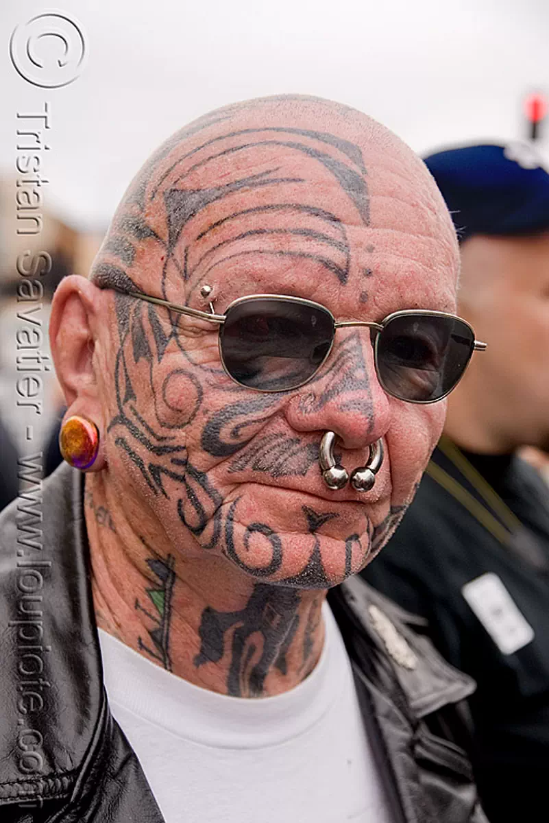 face tattoo, bald, dore alley fair, face tattoos, full face tattoo, nose piercing, septum piercing, skin, sunglasses, tattooed, stock photo