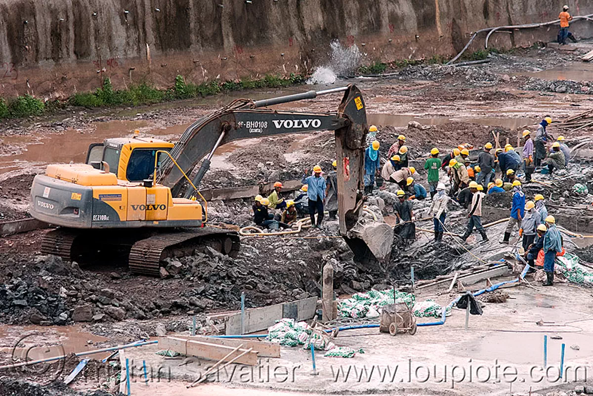 volvo EC210BLC excavator - power house site - nam theun 2 hydroelectric project (laos), construction, downstream canal, heavy equipment, hydraulic, hydro-electric, machinery, nam theun power company, ntpc, volvo ec210, volvo ec210b excavator, volvo excavalor, stock photo