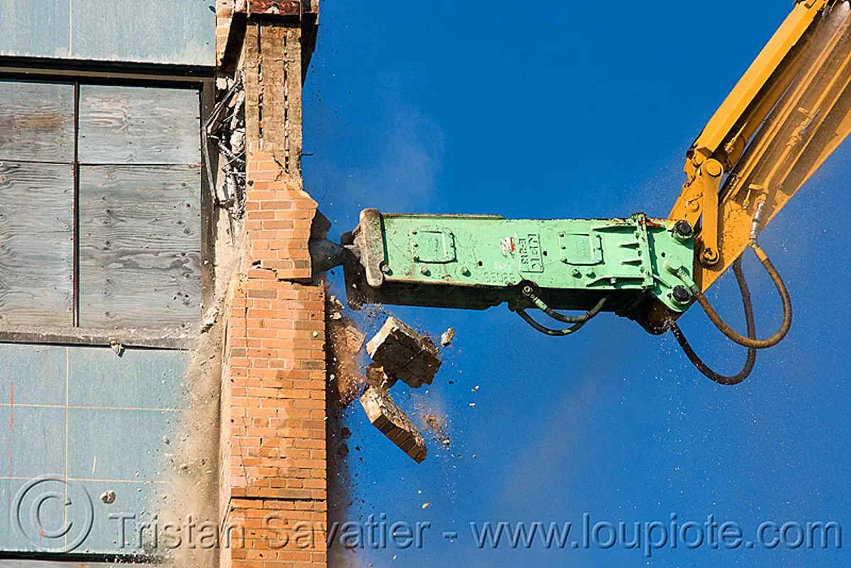 hydraulic hammer breaker - NPK E213 - building demolition, abandoned building, abandoned hospital, attachment, caterpillar, heavy equipment, hydraulic breaker, machinery, npk e-213, presidio hospital, presidio landmark apartments, stock photo