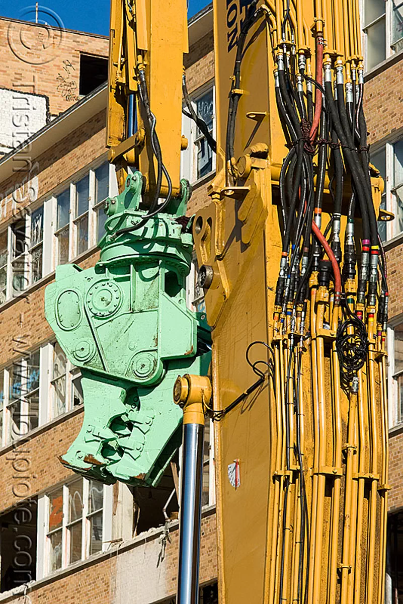 caterpillar MP30 concrete pulverizer jaws on caterpillar CAT 385C ultra high demolition excavator - building demolition, abandoned building, abandoned hospital, anthropomorphic, attachment, cat mp30, caterpillar 385c, caterpillar excavator, crane, excavators, heavy equipment, high reach demolition, hydraulic, long reach demolition, machinery, presidio hospital, presidio landmark apartments, stock photo