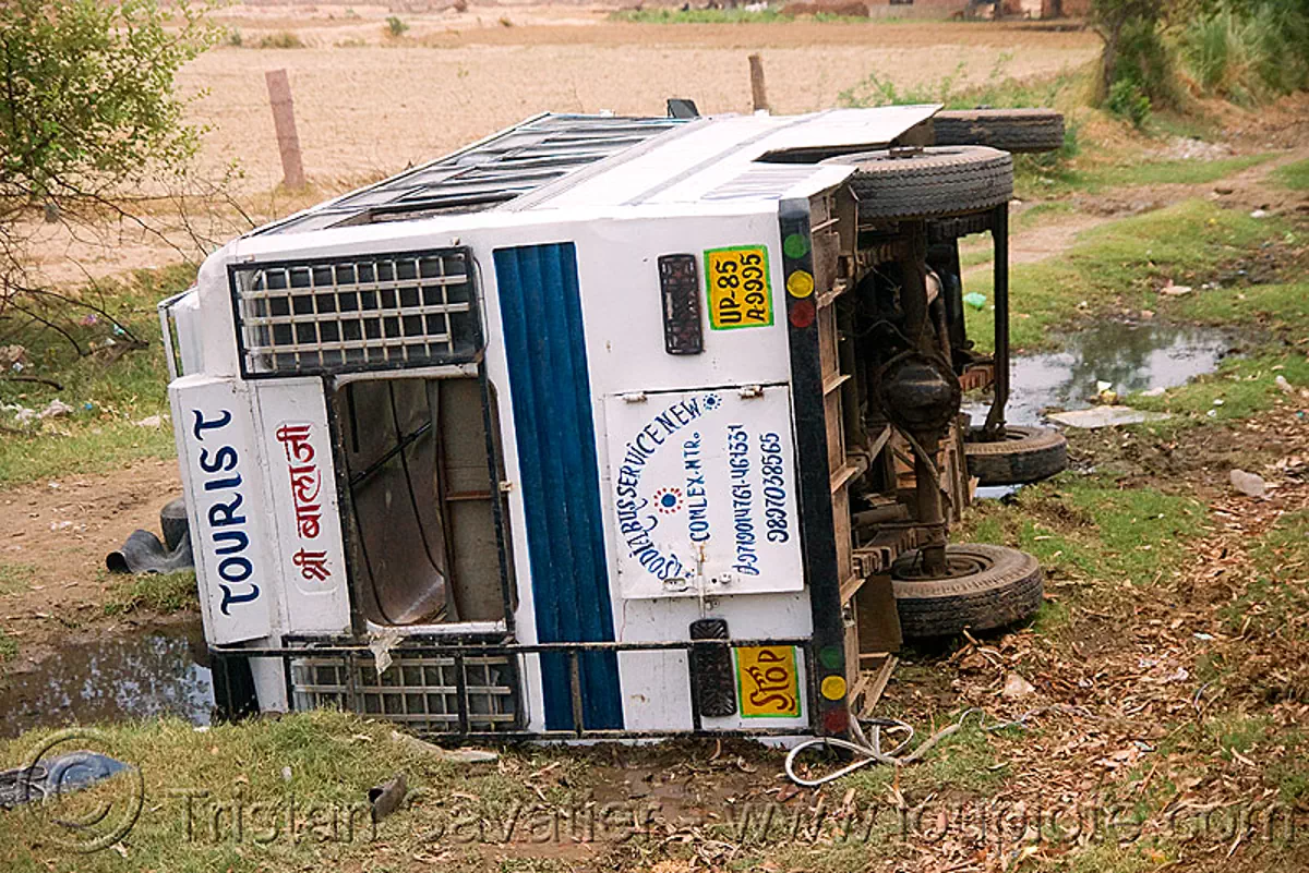 overturned tourist bus (india), crash, road, traffic accident, wreck, stock photo