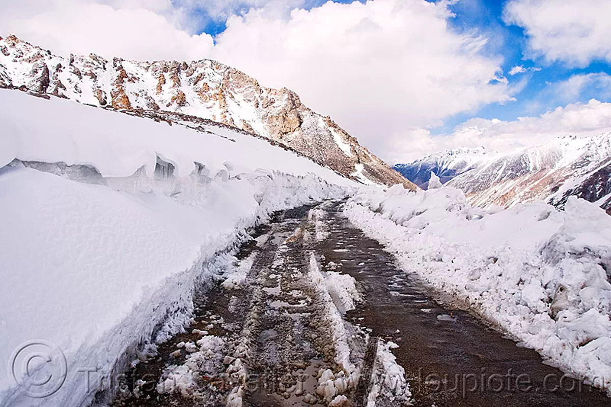 mud and snow on the road - khardungla pass - ladakh (india), khardung la pass, mountain pass, mountains, stock photo