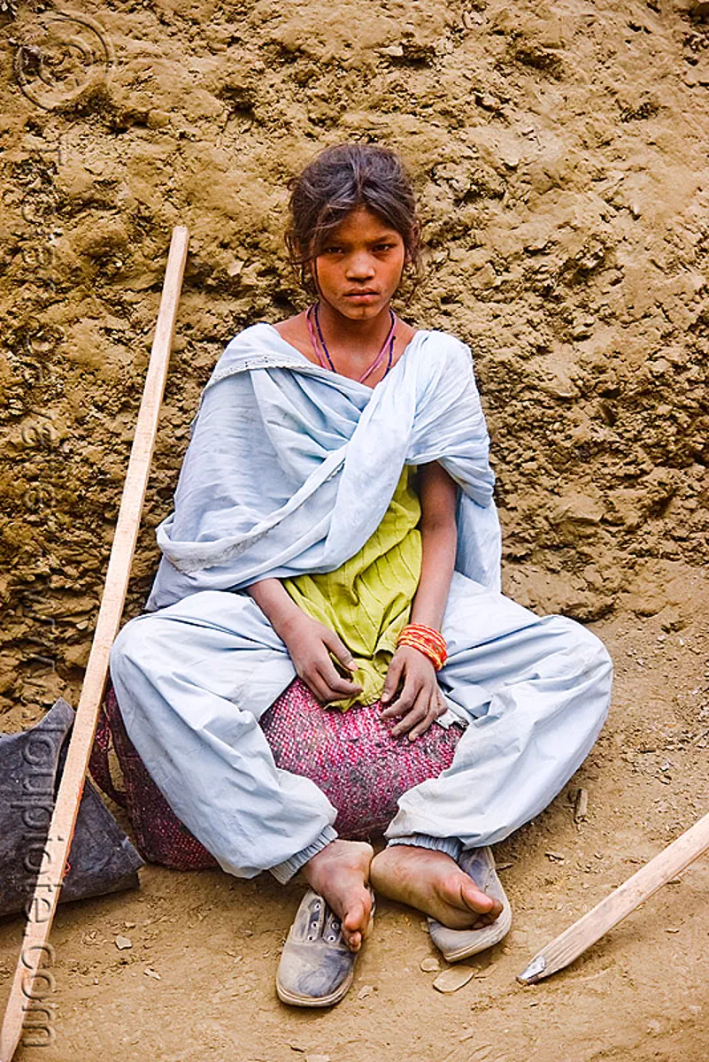 exhausted and dusty young girl resting on trail - pilgrim - amarnath yatra (pilgrimage) - kashmir, amarnath cave, hiking cane, mountain trail, mountains, saree, sari, trekking, walking stick, yatris, अमरनाथ गुफा, stock photo