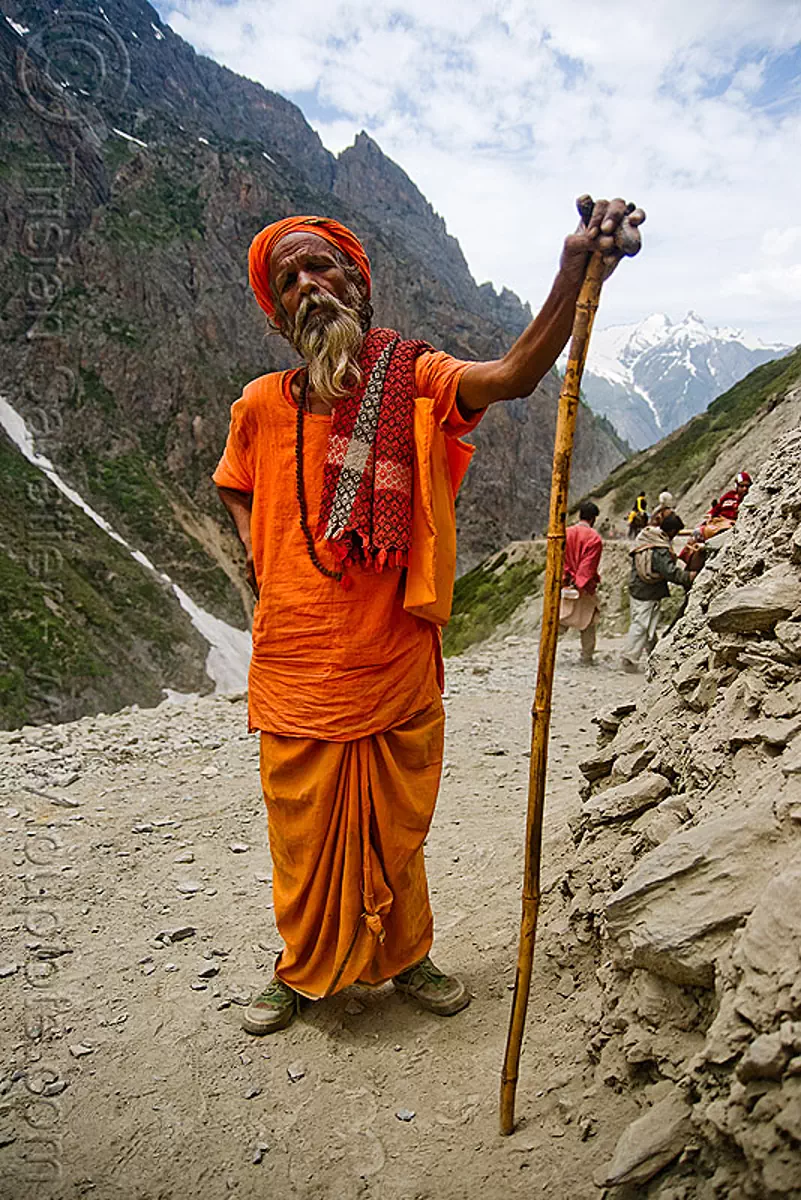 sadhu (hindu holy man) with cane on trail - amarnath yatra (pilgrimage) - kashmir, amarnath cave, baba, beard, bearded, hiking cane, mountain trail, mountains, old man, pilgrim, s&acirc;dhu, trekking, walking stick, yatris, अमरनाथ गुफा