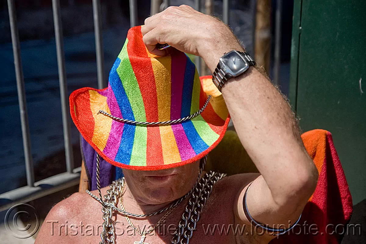 rainbow hat - dore alley fair (san francisco), man, rainbow colors, wrist watch, stock photo