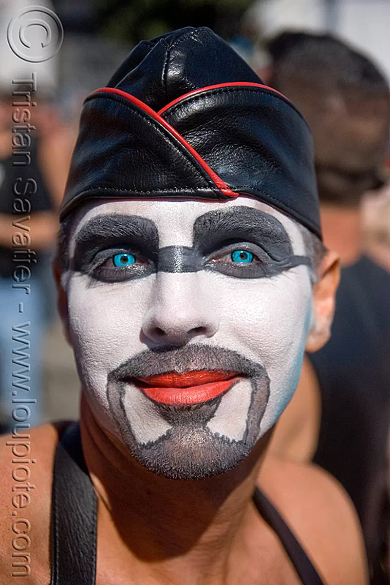 colored contact lenses - very blue eyes, blue contact lenses, blue contacts, chi energy, color contact lenses, dore alley fair, face painting, facepaint, leather hat, makeup, man, red lipstick, special effects contact lenses, theatrical contact lenses, white face paint, stock photo
