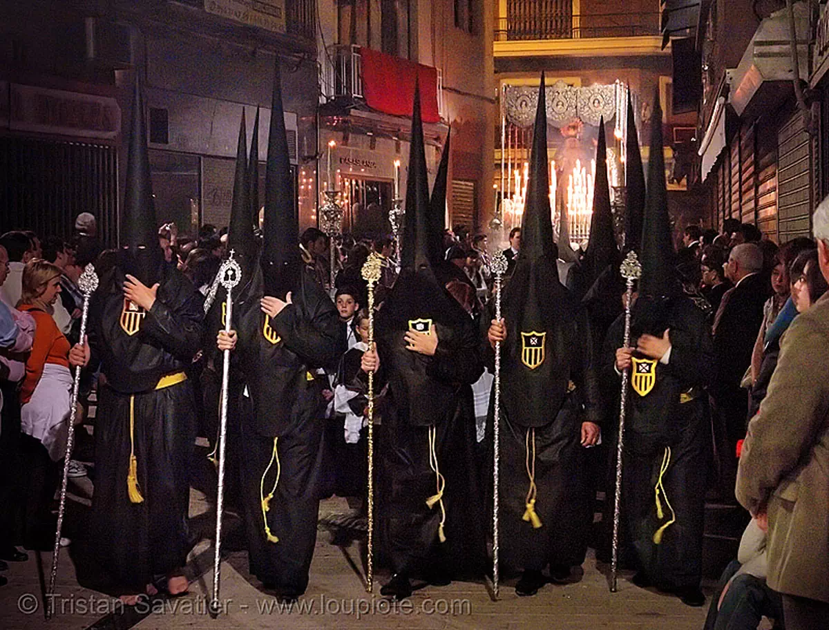 hermandad de la pasi&oacute;n - semana santa en sevilla, andaluc&iacute;a, candles, capirotes, cofrad&iacute;a, easter, espa&ntilde;a, hermandad de la pasi&oacute;n, nazarenos, night, parade, procesi&oacute;n, procession, religion, spain, stock photo