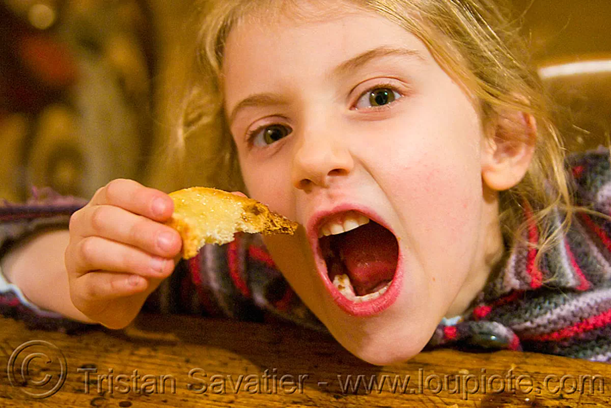 child and honey toast, apolline, blond, blonde, breakfast, devouring, eating, girl, kid, making faces, mouth, teeth, toasted bread