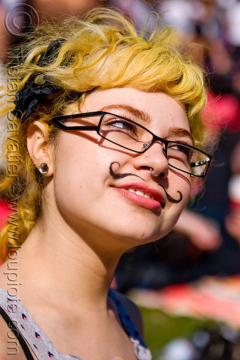 mustache makeup, dolores park, ear piercing, eyewear, gay pride festival, nose piercing, septum piercing, yellow hair, stock photo