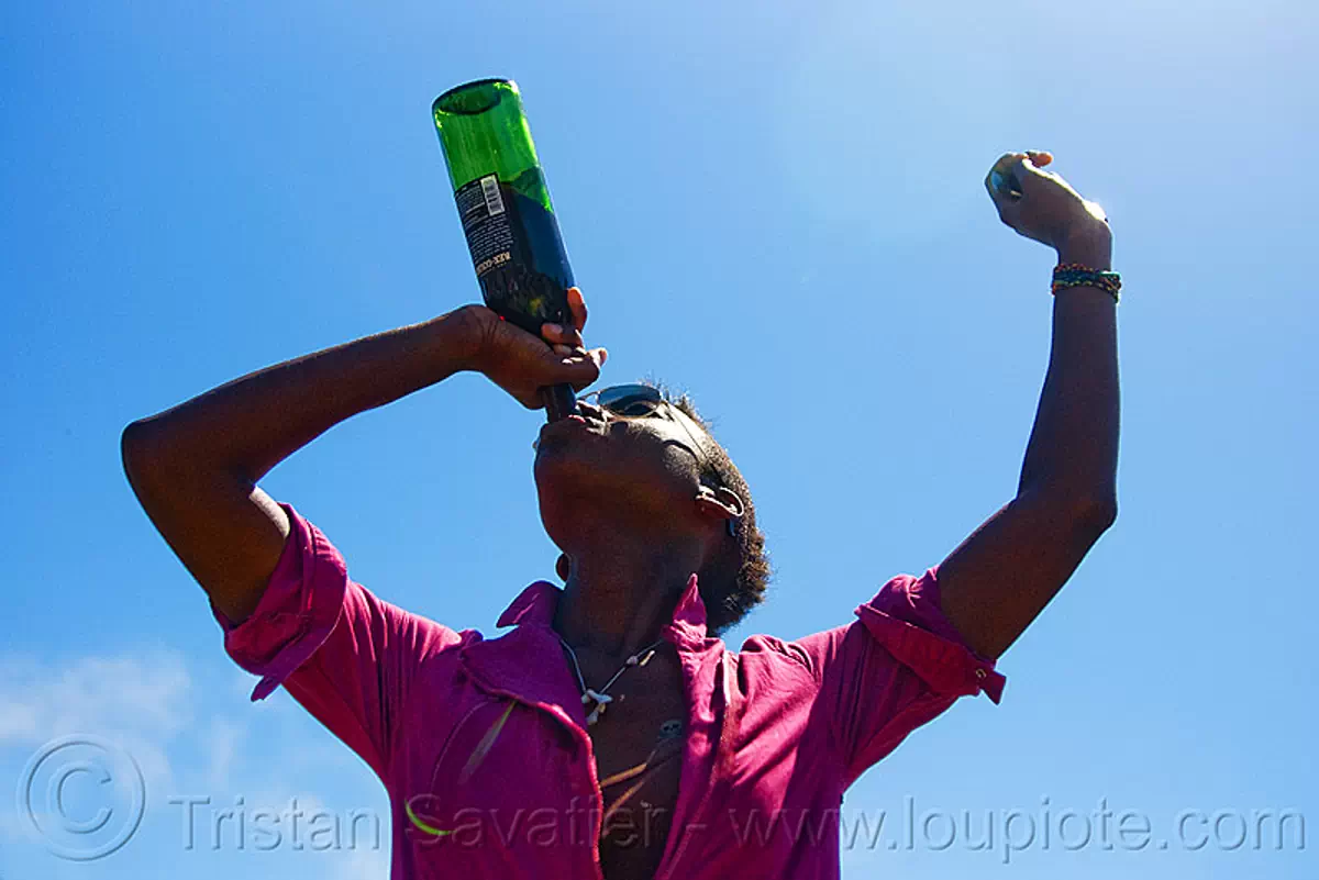 drinking a bottle of red wine, dolores park, gay pride festival, wine bottle, zh&uacute;, stock photo