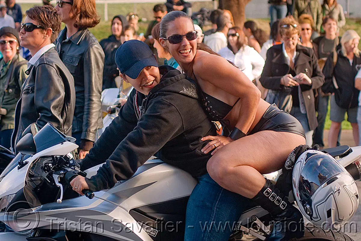 women on honda CDR motorcycle, dolores park, dykes on bikes, full face helmet, gay pride festival, motorbike, nina, parade, stock photo