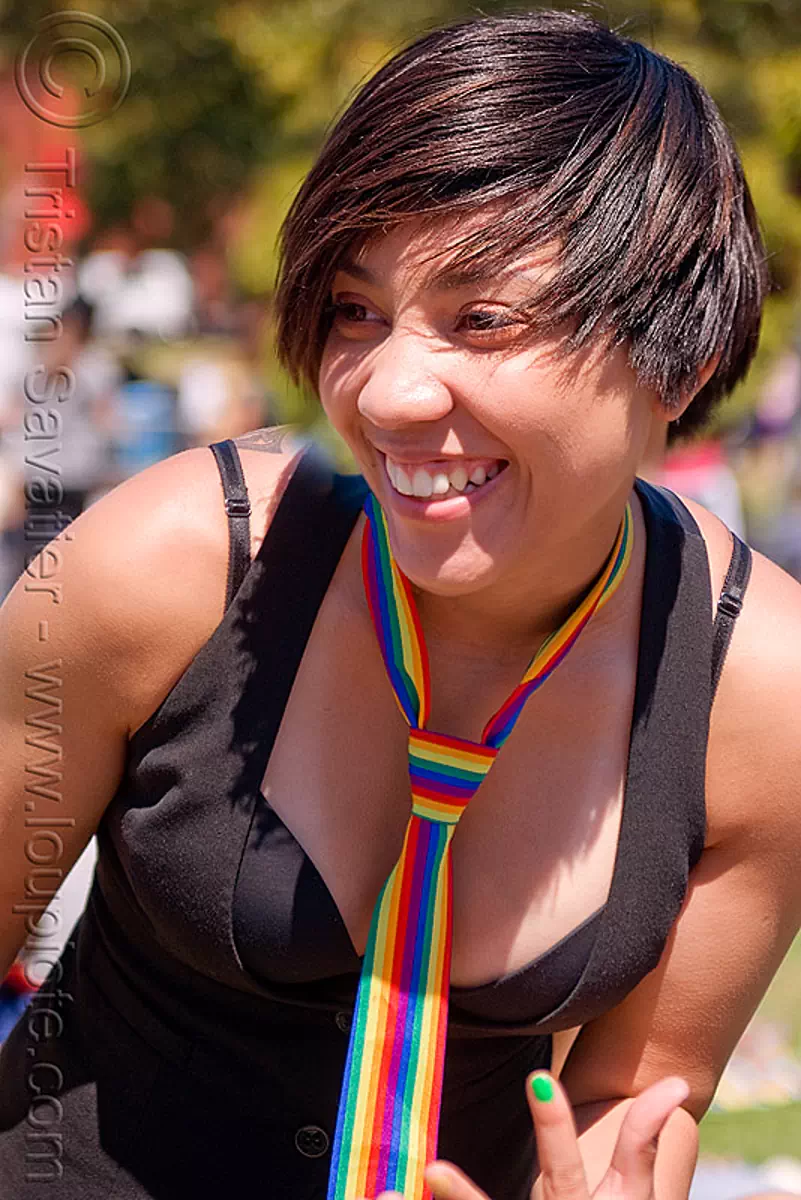 woman with rainbow necktie, dolores park, gay pride festival, rainbow colors, stock photo