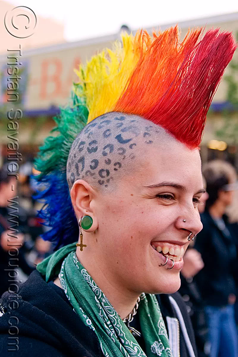 rainbow mohawk, ear piercing, gauged ears, gay pride festival, head tattoo, jessi, lip piercing, mohawk hair, panther tattoo, rainbow colors, rainbow hair, scalp tattoo, stretched earlobes, tattooed, stock photo