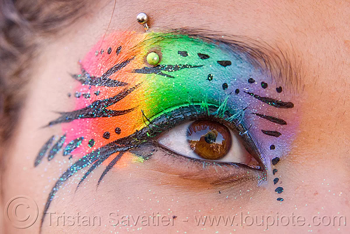 rainbow eye makeup, dolores park, eye makup, eyebrow piercing, face painting, facepaint, gay pride festival, glitter, rainbow colors, rainbow makeup, stock photo