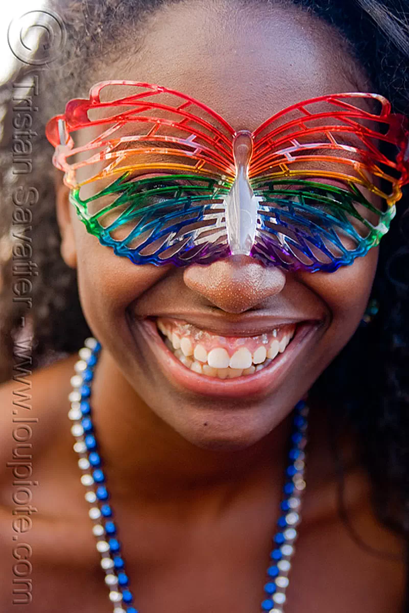 black girl with rainbow carnival mask, gay pride festival, lelani, rainbow colors, stock photo