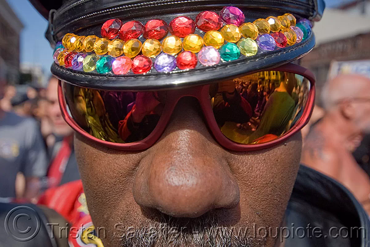 cap with colorful bindis - dore alley fair, african american man, leather cap, rainbow colors, sunglasses, stock photo