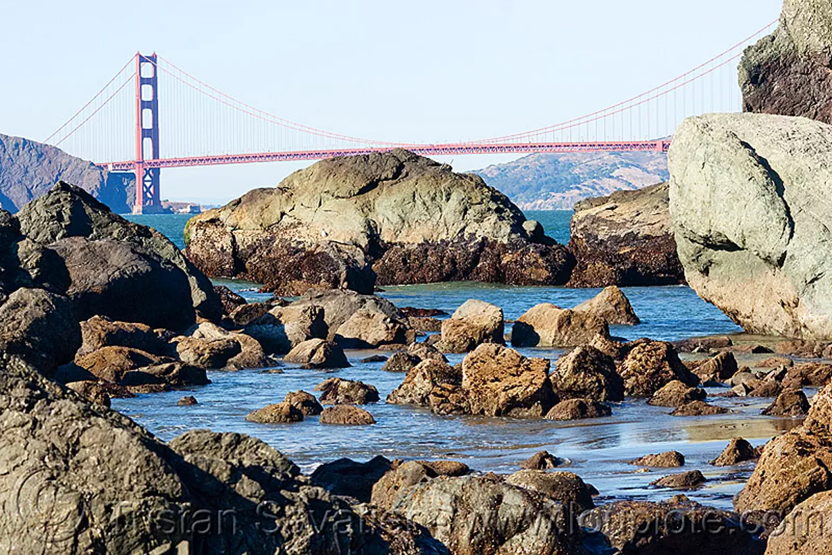 california coast before the oil spill - golden gate bridge (san francisco), land's end, ocean, rocks, suspension bridge, stock photo