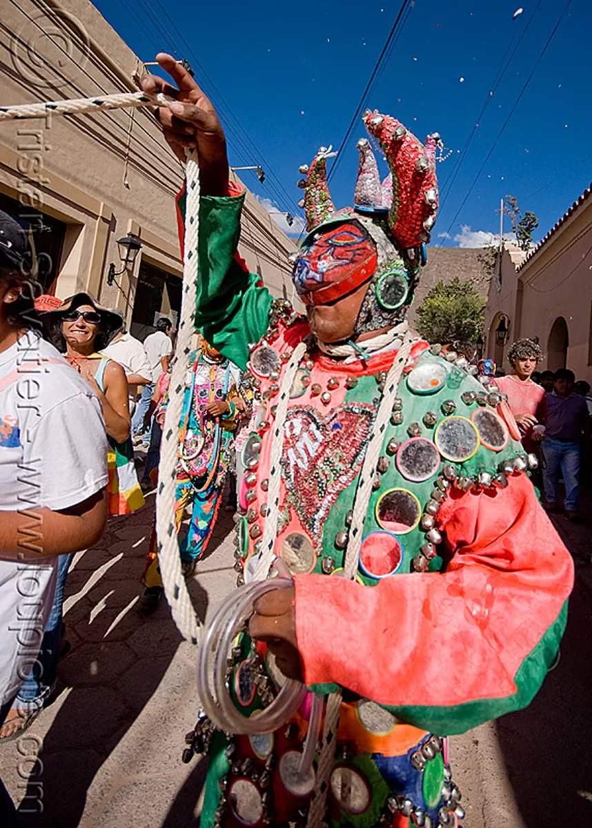 diablo carnavalero holding his tail - carnaval (argentina), carnival, costume, diablo de carnaval, folklore, horns, man, mask, mirrors, noroeste argentino, quebrada de humahuaca, tilcara, tribal, stock photo