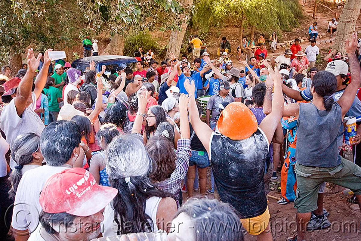 crowd dancing around the apacheta - carnaval de tilcara (argentina), carnival, noroeste argentino, quebrada de humahuaca