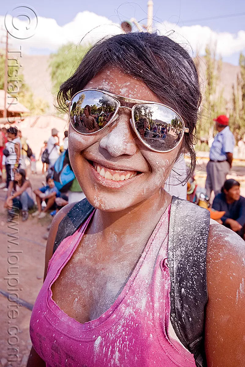 girl with mirror sunglasses and talk powder - carnaval de tilcara (argentina), carnival, noroeste argentino, quebrada de humahuaca, stock photo