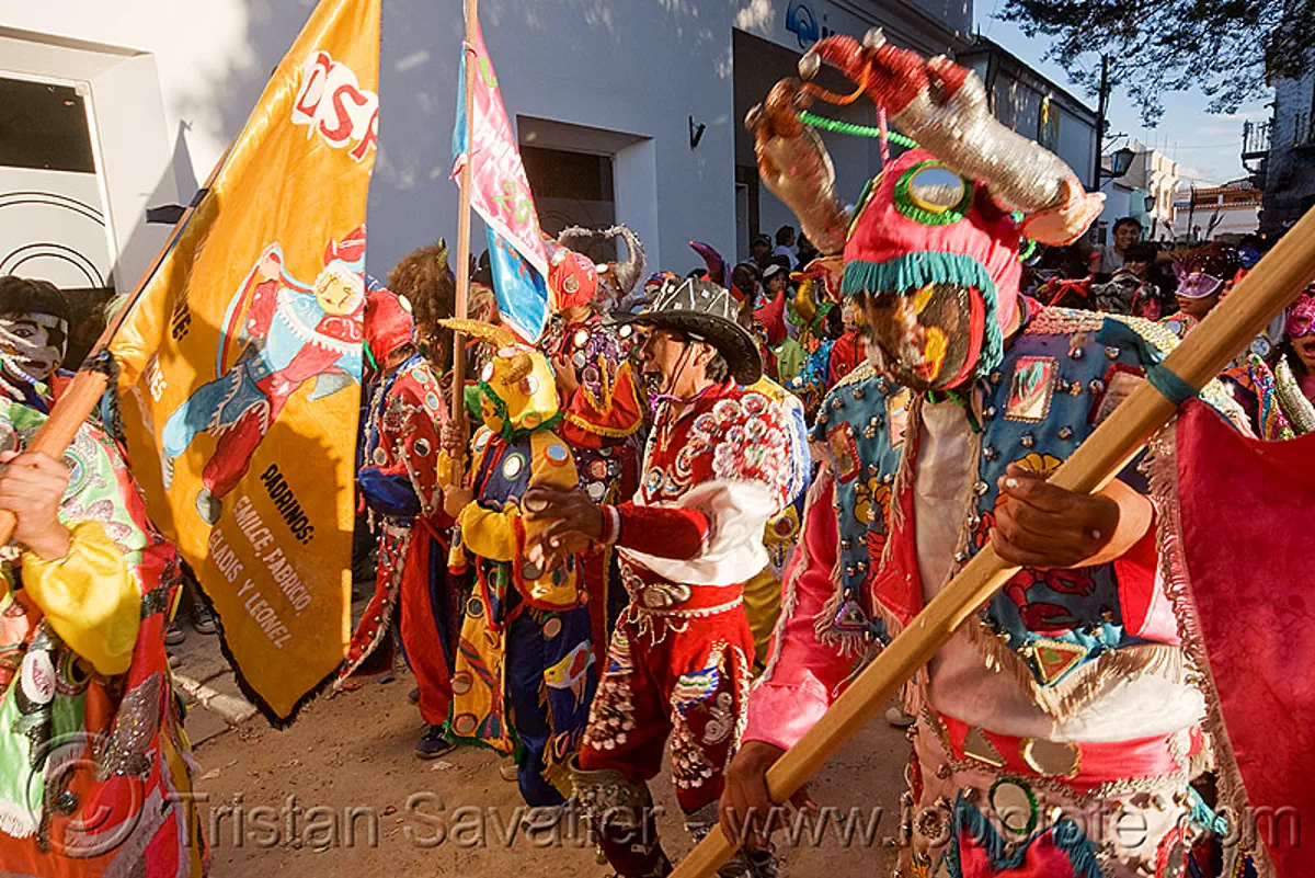 la comparsa "los picaflores" - carnaval de humahuaca (argentina), carnival, costume, diablo carnavalero, diablo de carnaval, flag, folklore, horns, man, mask, mirrors, noroeste argentino, quebrada de humahuaca, tribal, stock photo